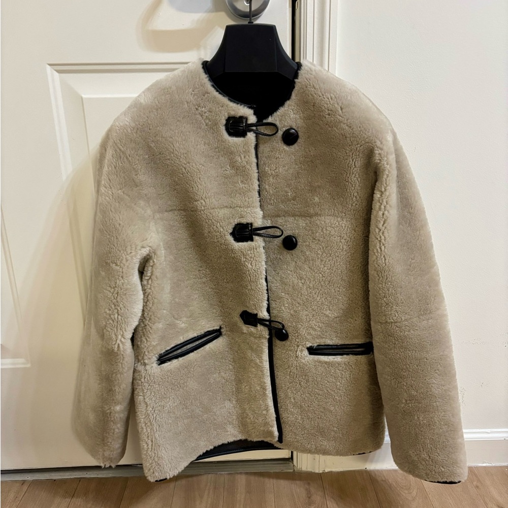 Mango Fur-effect coat with appliqués.